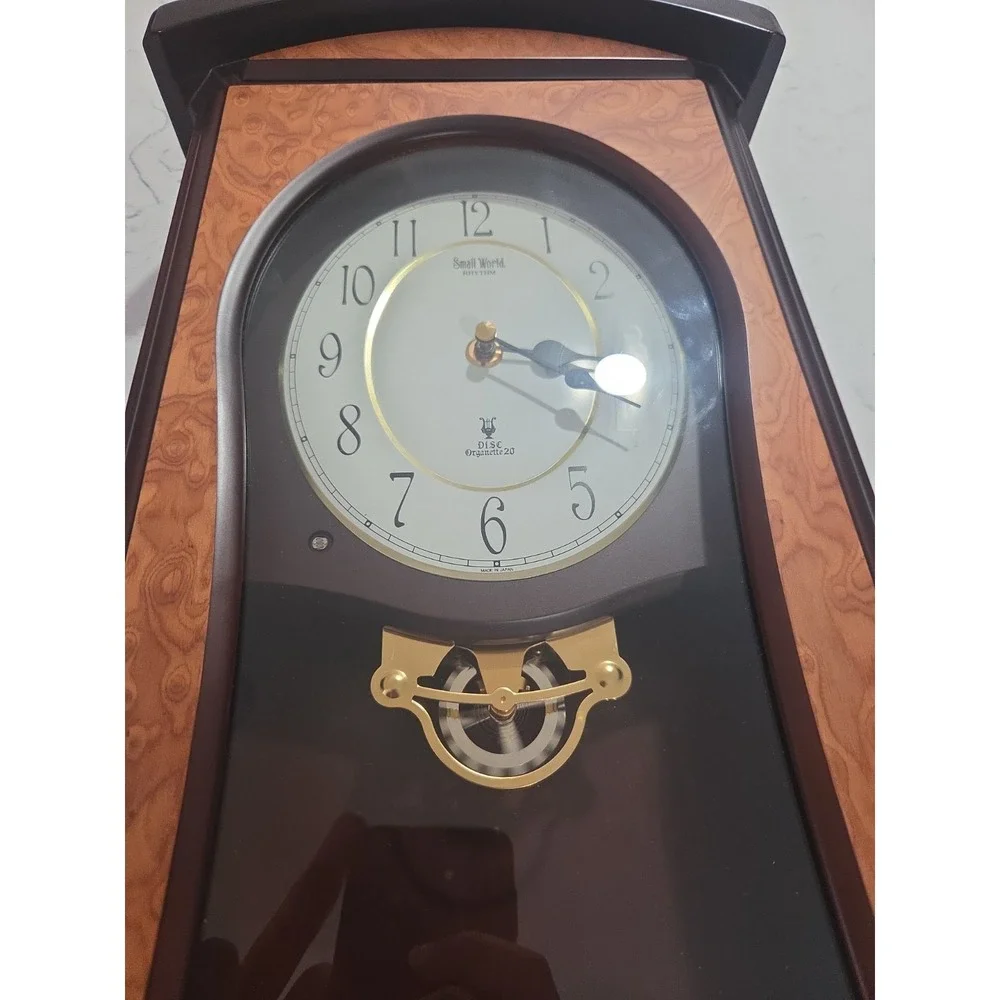 Rhythm Small World Disc Organette 20 Wall Clock